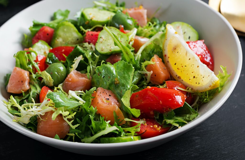 Ketogenic salad with salted salmon fish